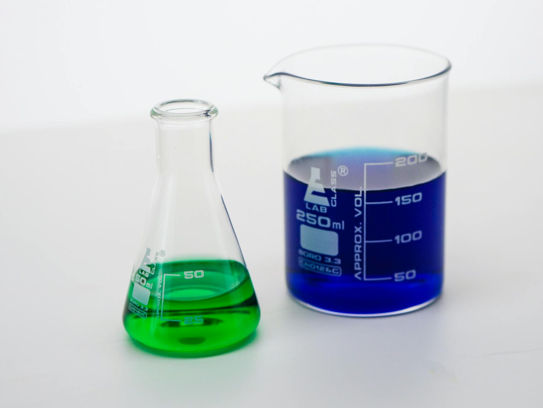 close up view of colorful liquids in laboratory glasswares